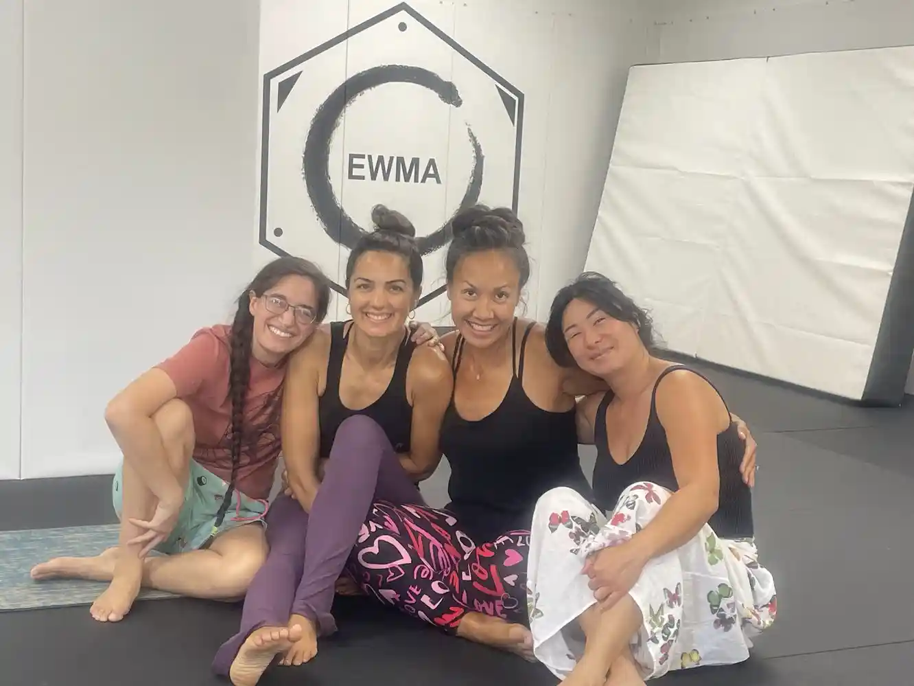 Lisa and students smiling together at Evolution Wellness Martial Arts studio in Palmas del Mar